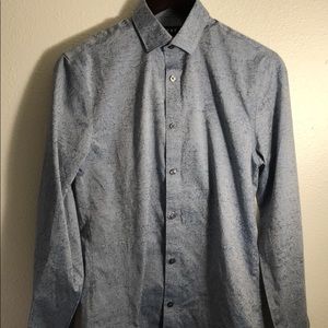 A silk blue long sleeve button down a print.